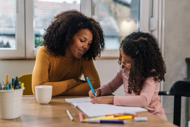 istock mother and daughter at home 1597844201