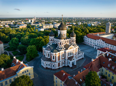Aerial view of the old town of the capital city of Tallinn with famous Alexander Nevsky Cathedral at sunset. Tallinn Old Town Cityscape of Toompea Hill. Drone view towards St. Alexander Nevski Cathedral and surrounding streets and buildings to Tallinn City horizon. Alexander Nevsky Cathedral, Toompea Hill, Old Town Tallinn, Estonia, Baltic Countries, Europe