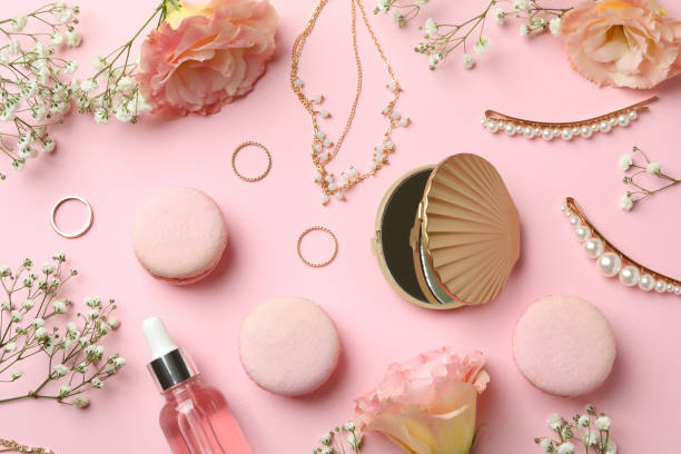 istock Female accessories and macaroons on pink background 1597871891