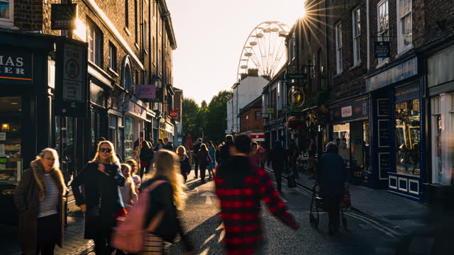 Time lapse of Crowded Commuter Tourism people walking and shopping in York walking street shopping area