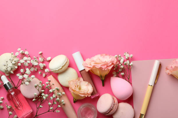 istock Female accessories and macaroons on pink background 1597879830