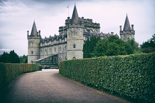 Inveraray, United Kingdom- July 21, 2023: Toned photograph of Inveraray Castle, located by the Loch Fyne on the west coast of Scotland. Inveraray Castle was built in the 18th century.