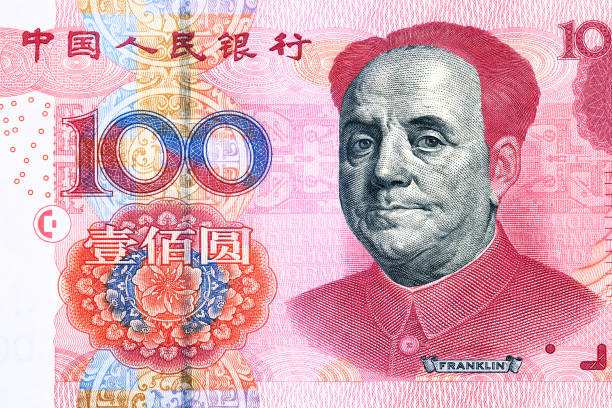 istock US Dollar and Yuan currency banknotes. USD vs RMB economical war concept 1597911800