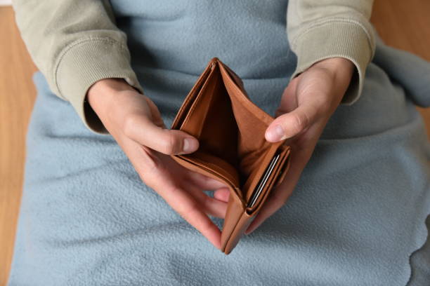 istock a woman with an empty purse 1597952050