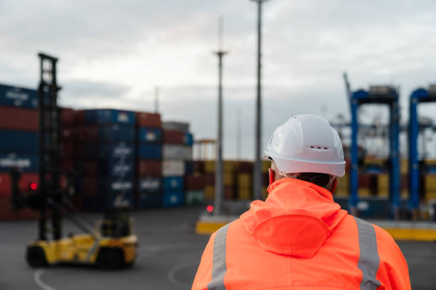 istock Rear view of worker at Port. 1597978127