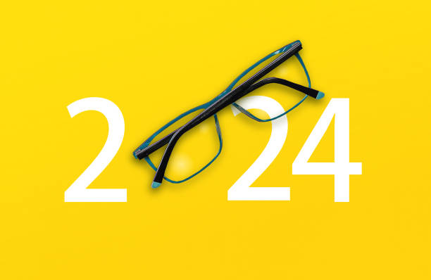 istock 2024 with glasses on yellow isolated background 1598008826