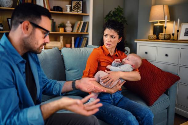 istock Mid adult couple arguing on sofa at home. 1598019093