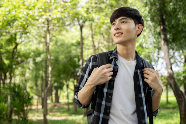 istock Young woman resting after a walk in the forest 1598034709