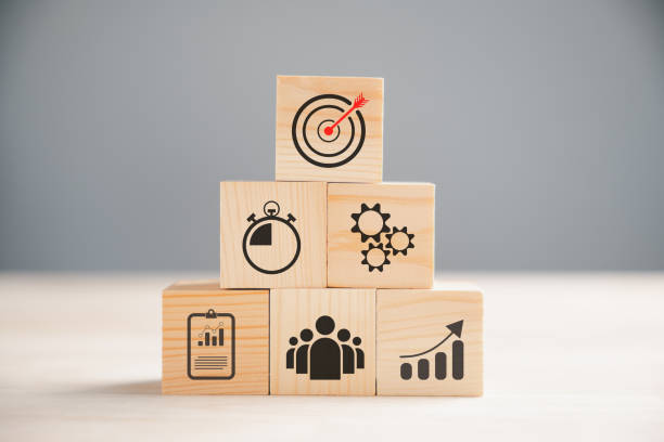 istock Wooden block cude step on table with Action Plan 1598040008