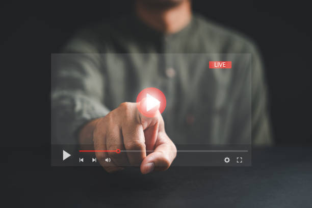 istock Elevate your entertainment experience with a touch as a man's hand interacts with the screen 1598040614