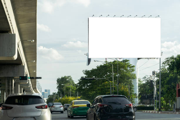 istock Blank billboard with copy space for text or content, mockup of a blank billboard in a big city, evening scene. Space for your ad.. 1598046782