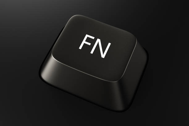 Black keyboard button with the word FN on a black background. 3d rendering illustration.