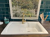 Kitchen sink with a modern faucet