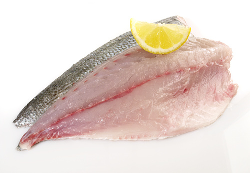 Fish and Seafood - Grey Gilthead Seabream Fillet with Lemon isolated on white Background