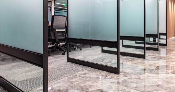 istock Multiple glass doors of modern meeting room are opened 1598105075