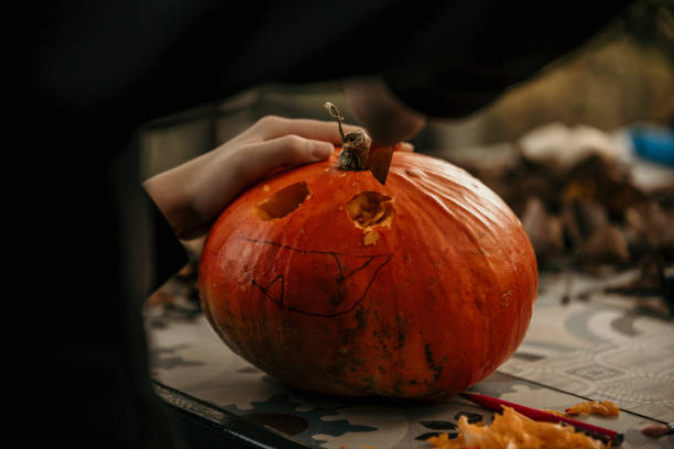 istock Creative girl making a Halloween decoration. 1598110069
