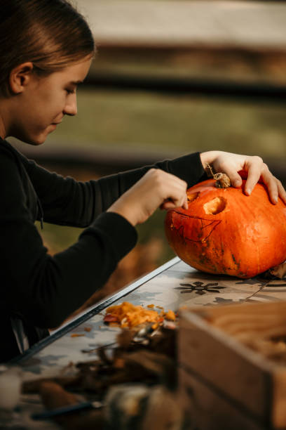 istock Creative girl making a Halloween decoration. 1598114917