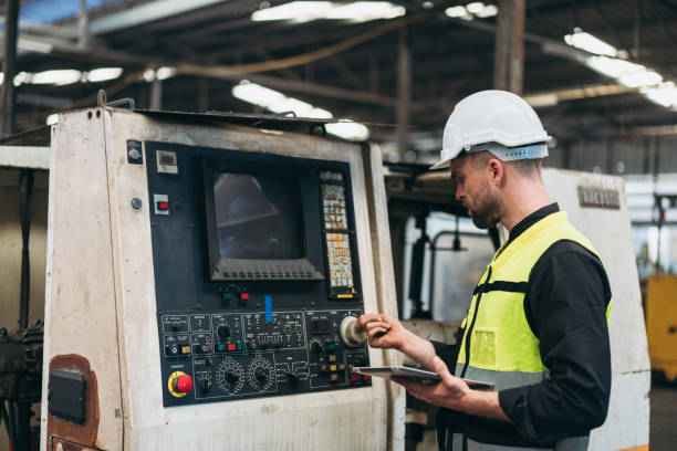 istock Engineer is working in the factory. Mechanical technicians are maintaining the engine. 1598132580