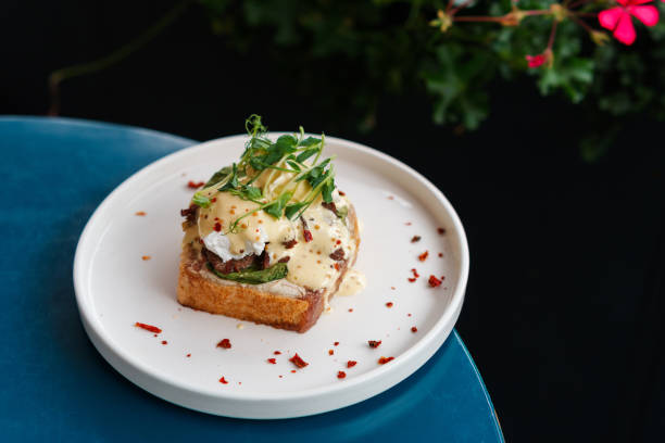 istock Breakfast with eggs, roast beef and salad 1598147859