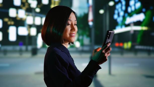 istock Person checking messages on promenade 1598148424