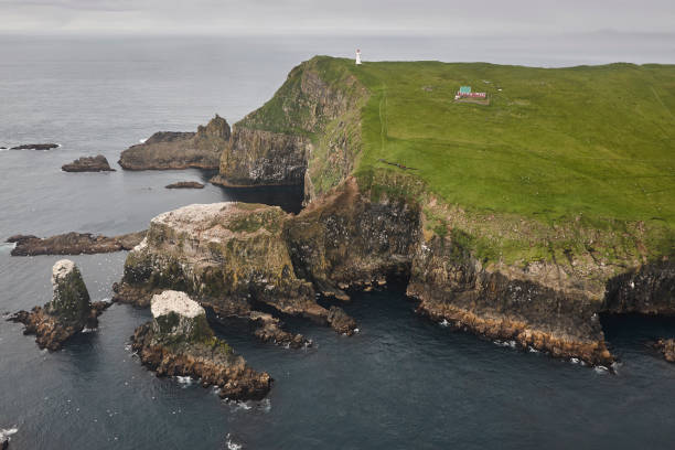 istock Mykines lighthouse and cliffs on Faroe islands from helicopter 1598155127