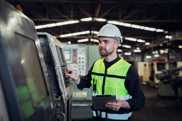 istock Warehouse workers checking details work on a tablet in the background warehouse., Industrial and industrial concept 1598158334