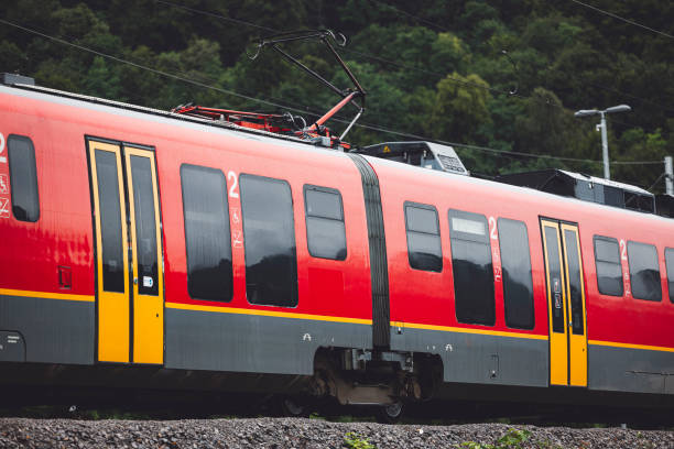 istock Railway station with modern red commuter train 1598197471