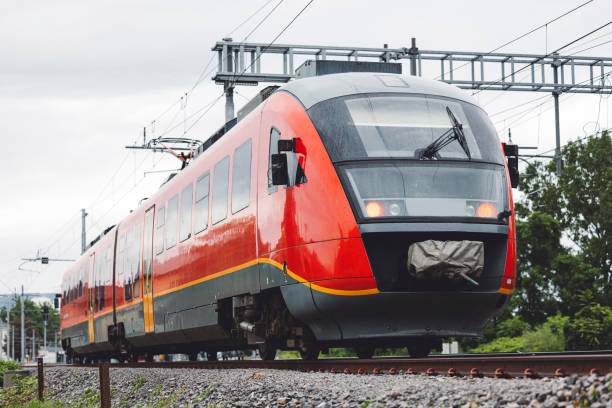 istock Railway station with modern red commuter train 1598197480