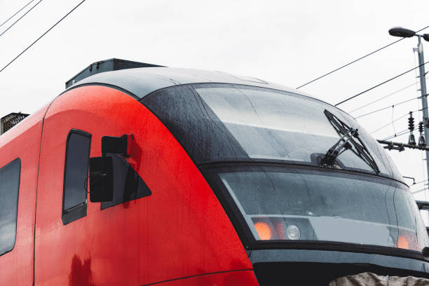 istock Railway station with modern red commuter train 1598197482