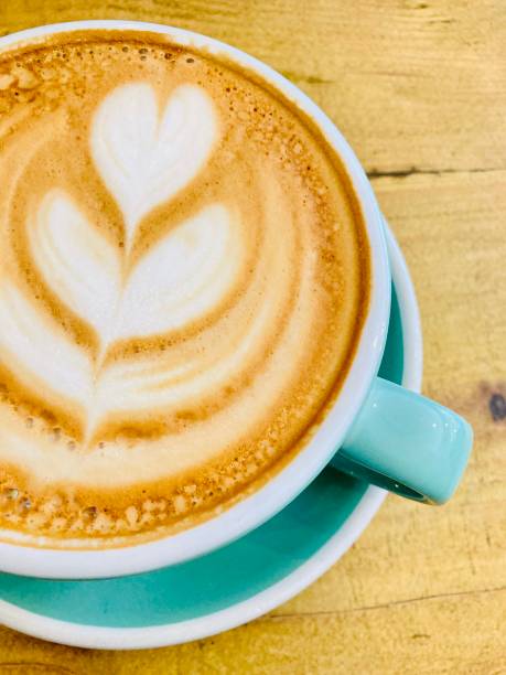 A latte with latte art served in cafe