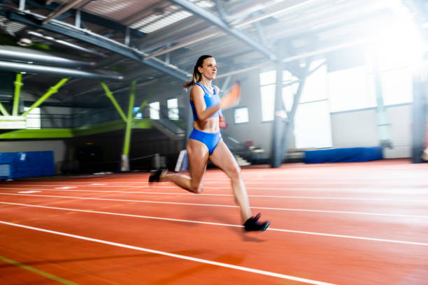 istock Athlete woman running on track 1598211439