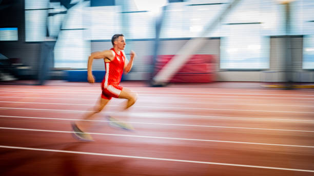 istock Athlete man running on track 1598211441