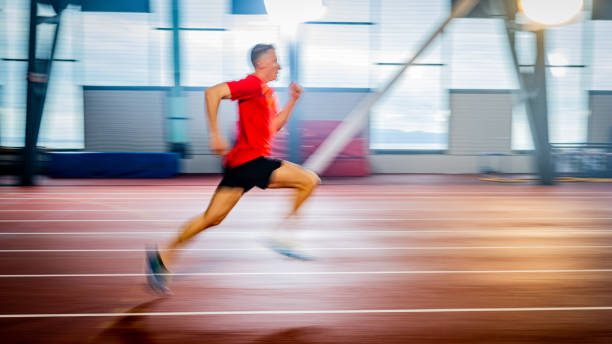 istock Athlete man running on track 1598211451