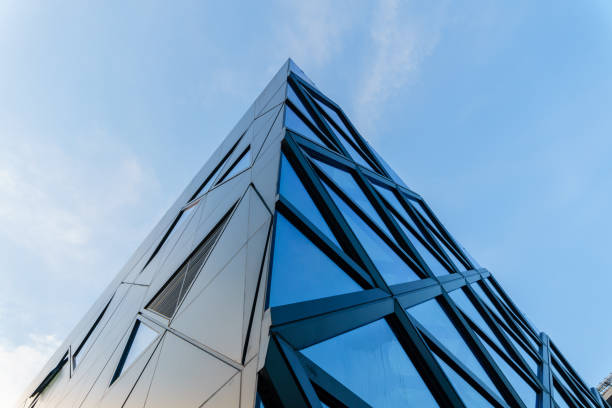 istock empty glass windows at modern building exterior with cloudy sky. 1598214170