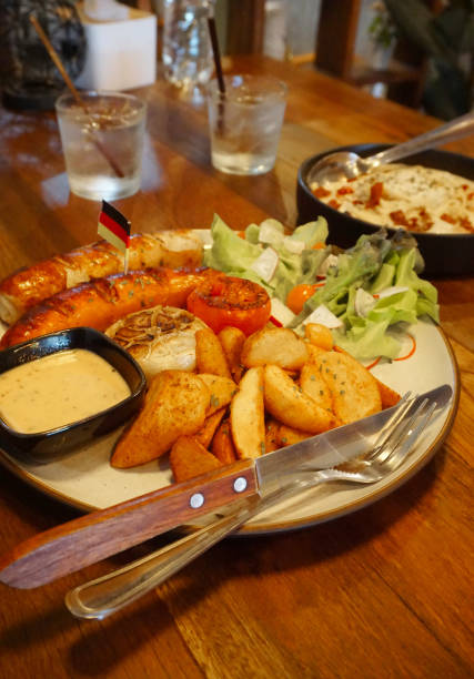 istock German sausage grilled with salad and potato chips 1598235009