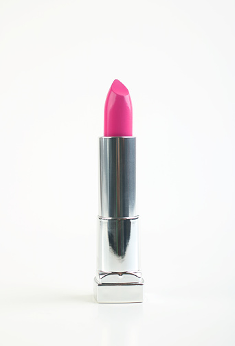 Pink lipstick isolated on white background.