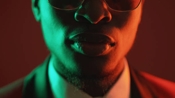 istock Neon face masculine determination color light man 1598236662