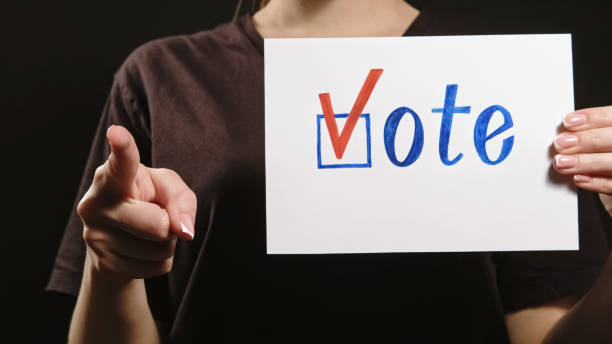 istock Vote election political campaign hand poll check 1598238374