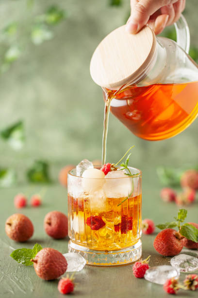 istock Lychee raspberry iced tea with mint leaves in glass. Summer drink 1598241981