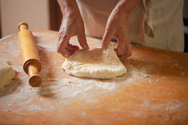 istock Women's hands make pasty dough 1598242284