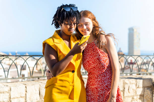 istock Genuine Affection: Redhead and Black Friend Sharing Warm Embrace 1598256283
