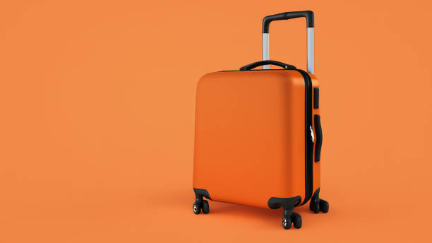 istock Orange holiday suitcase on wheels with shadow on orange background 1598259990