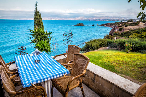 istock Dinning table on the rocky shore over the sea 1598272007