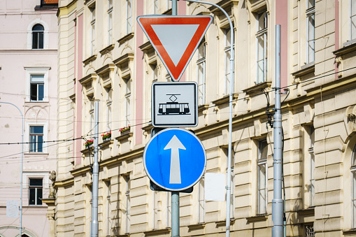 Traffic signs, trams, yield sign, one way road
