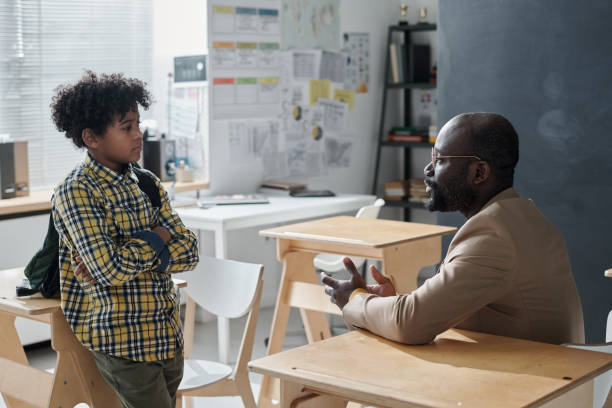 istock Teacher talking to pupil after lessons 1598304540