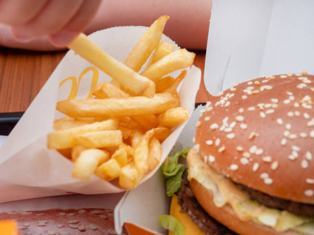 istock Fries and a Cheeseburger Displayed on a Tablet at Restaurant 1598313731
