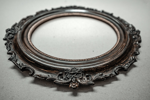 Antique mirror in  an ornamental frame