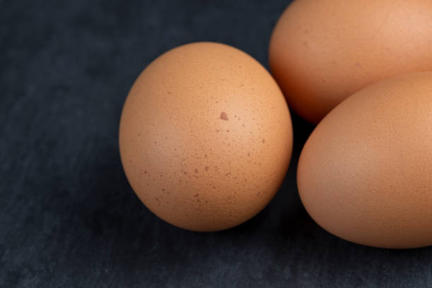 istock A clean whole orange chicken egg close-up on the table 1598346639