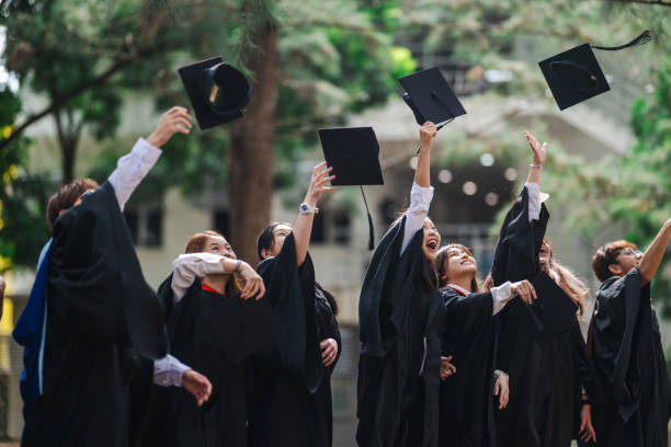 istock Hats off to Success: Asian Graduates Celebrate Together 1598347273