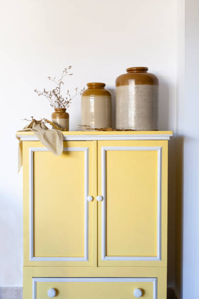 istock Vintage vases on old yellow cabinet 1598348274